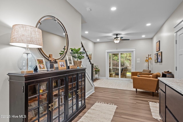 8805 Sound View Ct, Emerald Isle, NC 28594 - sitting room with stairs, wood finished floors, a ceiling fan, and recessed lighting