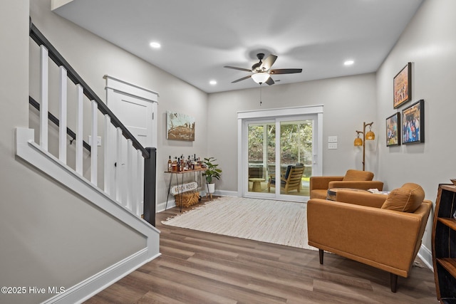 8805 Sound View Ct, Emerald Isle, NC 28594 - living room featuring ceiling fan, wood finished floors, recessed lighting, and stairs