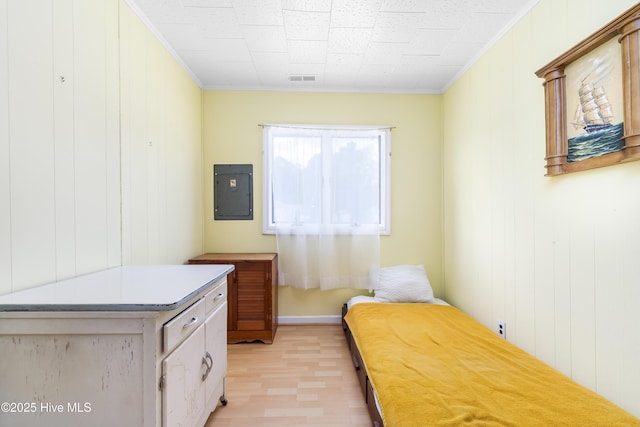 124 Holiday Knl, Hertford, NC 27944 - bedroom with electric panel, light wood-type flooring, and ornamental molding
