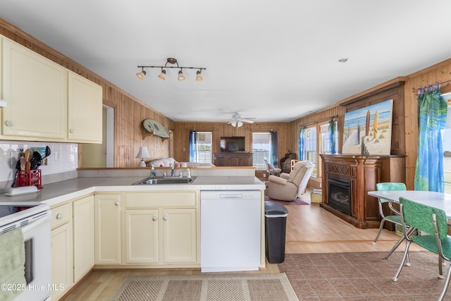 124 Holiday Knl, Hertford, NC 27944 - kitchen with white appliances, wood walls, a peninsula, open floor plan, and cream cabinets