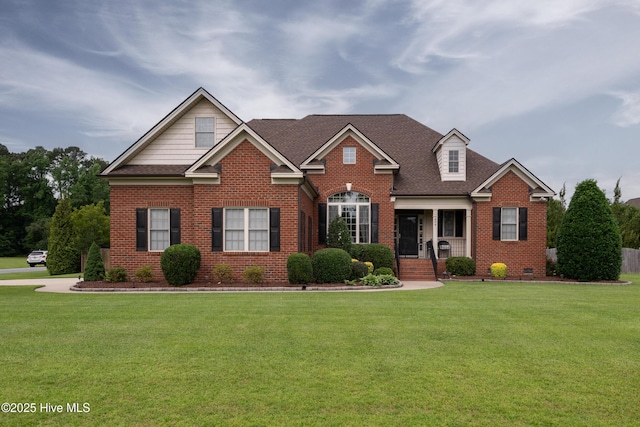 404 River Birch Dr, Greenville, NC 27858 - view of front of property featuring brick siding, a front lawn, a porch, and a shingled roof