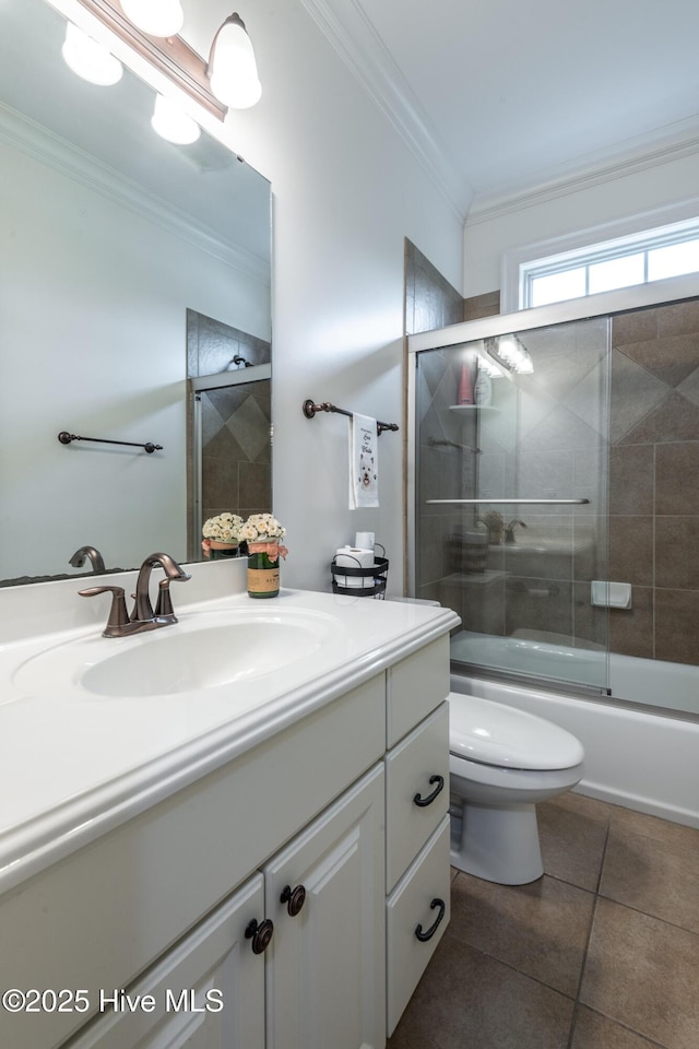 404 River Birch Dr, Greenville, NC 27858 - bathroom with crown molding, vanity, tile patterned floors, and shower / bath combination with glass door