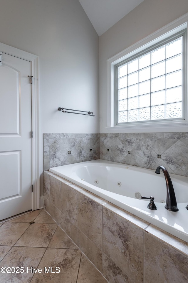 404 River Birch Dr, Greenville, NC 27858 - bathroom with vaulted ceiling and a jetted tub