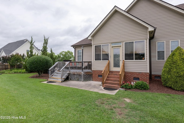 404 River Birch Dr, Greenville, NC 27858 - back of property featuring crawl space, entry steps, a deck, a lawn, and roof with shingles