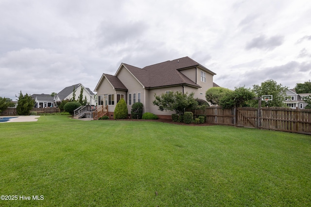 404 River Birch Dr, Greenville, NC 27858 - view of front facade featuring a fenced backyard and roof with shingles