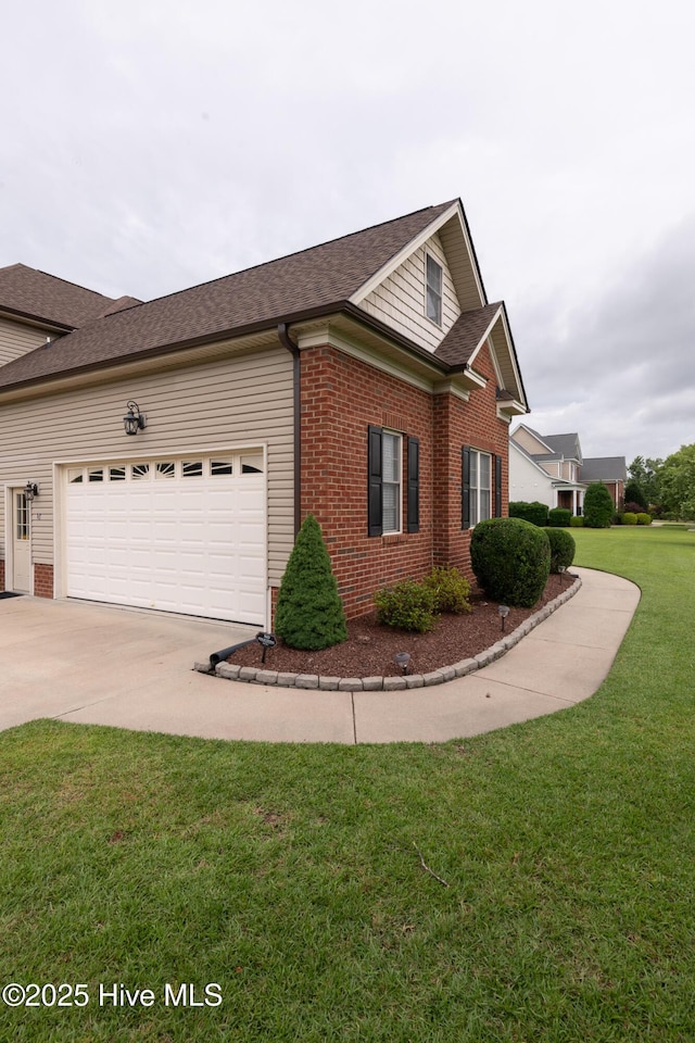 404 River Birch Dr, Greenville, NC 27858 - view of property exterior with an attached garage, brick siding, concrete driveway, and a yard