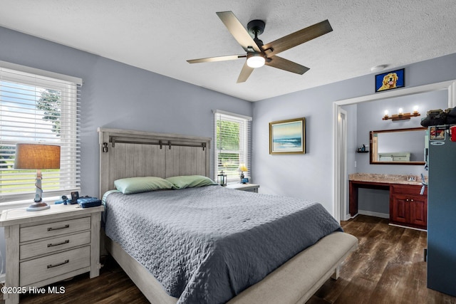 5023 Marathon Landing Ct, Castle Hayne, NC 28429 - bedroom featuring dark wood-type flooring, a textured ceiling, ensuite bath, and a ceiling fan