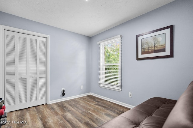 5023 Marathon Landing Ct, Castle Hayne, NC 28429 - sitting room featuring dark wood-style floors and a textured ceiling