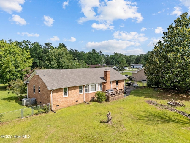 5023 Marathon Landing Ct, Castle Hayne, NC 28429 - rear view of house with crawl space, a fenced backyard, brick siding, a wooden deck, and a fire pit