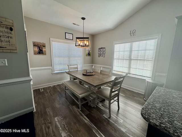 2925 Davenport Rd, Deep Run, NC 28525 - dining space featuring dark wood-type flooring, lofted ceiling, and a chandelier