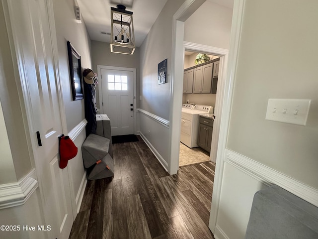2925 Davenport Rd, Deep Run, NC 28525 - doorway with dark wood-type flooring and washer and dryer