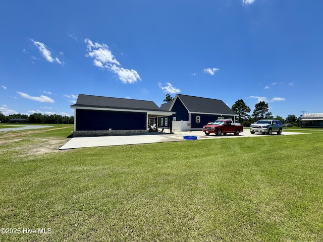 2925 Davenport Rd, Deep Run, NC 28525 - rear view of property with a lawn and a patio area