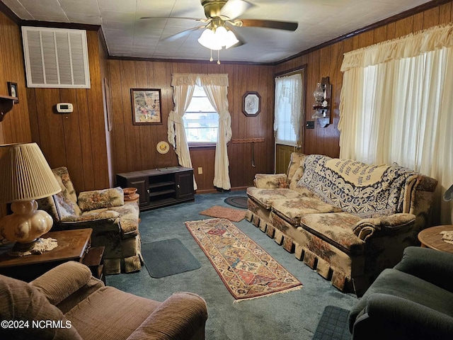 2630 Prison Camp Rd, Williamston, NC 27892 - carpeted living area with a ceiling fan, wood walls, and crown molding