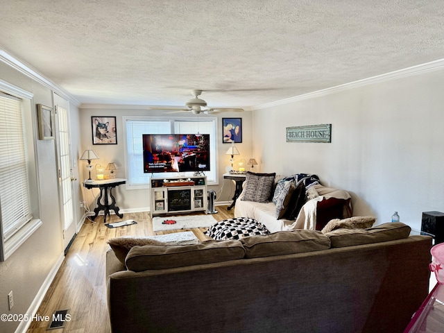 200 Carolina Beach Ave S, Carolina Beach, NC 28428 - living area with a textured ceiling, ceiling fan, crown molding, and wood finished floors