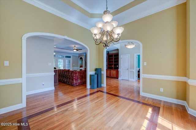 100 Knollwood Ct, New Bern, NC 28562 - spare room with arched walkways, light wood-style floors, ornamental molding, and ceiling fan