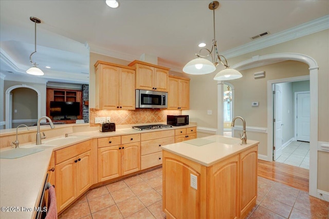100 Knollwood Ct, New Bern, NC 28562 - kitchen with appliances with stainless steel finishes, light brown cabinets, arched walkways, crown molding, and backsplash