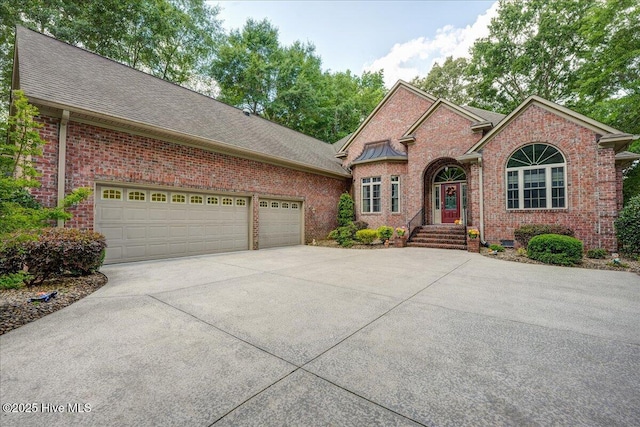 100 Knollwood Ct, New Bern, NC 28562 - traditional home featuring concrete driveway, brick siding, an attached garage, and a shingled roof