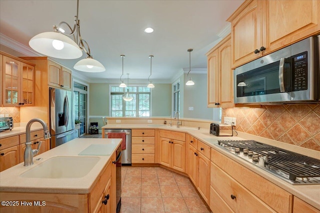 100 Knollwood Ct, New Bern, NC 28562 - kitchen featuring stainless steel appliances, light brown cabinets, crown molding, light countertops, and tasteful backsplash
