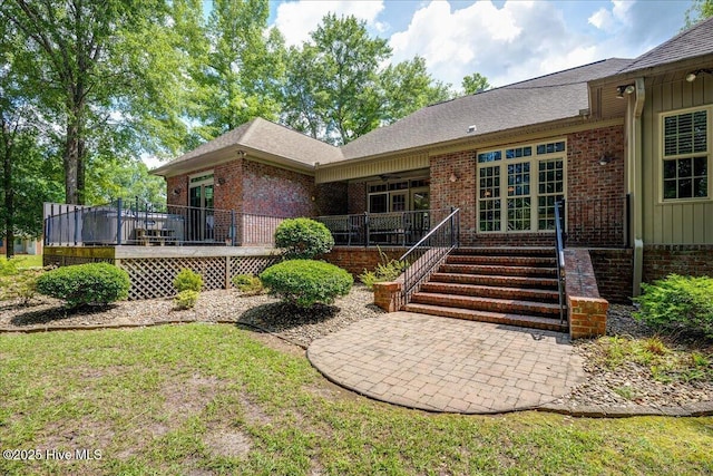 100 Knollwood Ct, New Bern, NC 28562 - back of property featuring brick siding, a wooden deck, and board and batten siding