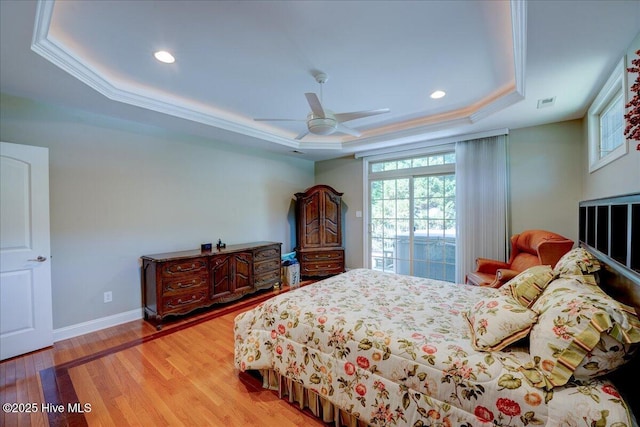100 Knollwood Ct, New Bern, NC 28562 - bedroom featuring a raised ceiling, multiple windows, light wood-type flooring, ornamental molding, and recessed lighting