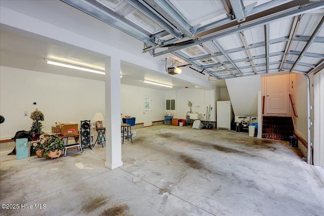 100 Knollwood Ct, New Bern, NC 28562 - garage with a garage door opener and freestanding refrigerator
