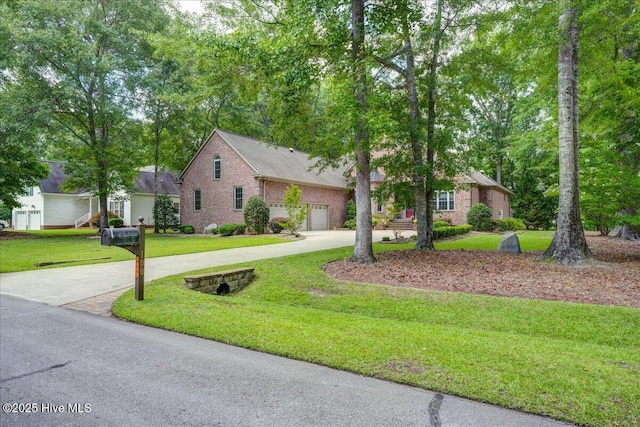 100 Knollwood Ct, New Bern, NC 28562 - view of front facade featuring driveway, a front lawn, and brick siding