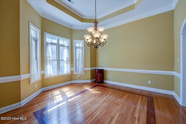 100 Knollwood Ct, New Bern, NC 28562 - unfurnished room with a chandelier, wood finished floors, a raised ceiling, and ornamental molding