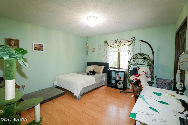 254 W Devonshire Ave, West End, NC 27376 - bedroom with wood finished floors and a textured ceiling