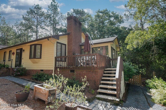 254 W Devonshire Ave, West End, NC 27376 - view of home's exterior featuring crawl space, stairway, a deck, and a chimney