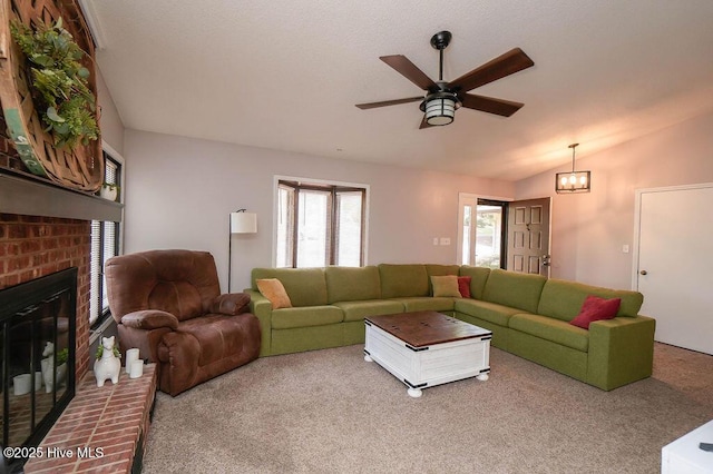 254 W Devonshire Ave, West End, NC 27376 - carpeted living area featuring ceiling fan, vaulted ceiling, and a fireplace