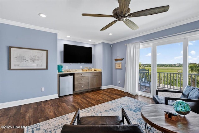 277 E Second St, Ocean Isle Beach, NC 28469 - living room featuring dark wood finished floors, ornamental molding, ceiling fan, and recessed lighting