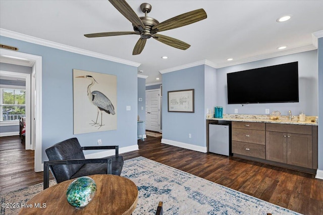 277 E Second St, Ocean Isle Beach, NC 28469 - living area featuring dark wood-type flooring, crown molding, ceiling fan, and recessed lighting