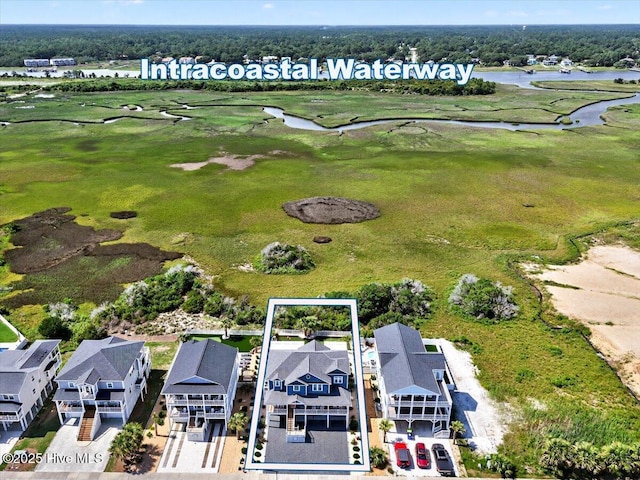 277 E Second St, Ocean Isle Beach, NC 28469 - aerial perspective of suburban area with a nearby body of water and a golf club