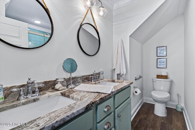 277 E Second St, Ocean Isle Beach, NC 28469 - bathroom featuring double vanity, wood finished floors, and ornamental molding
