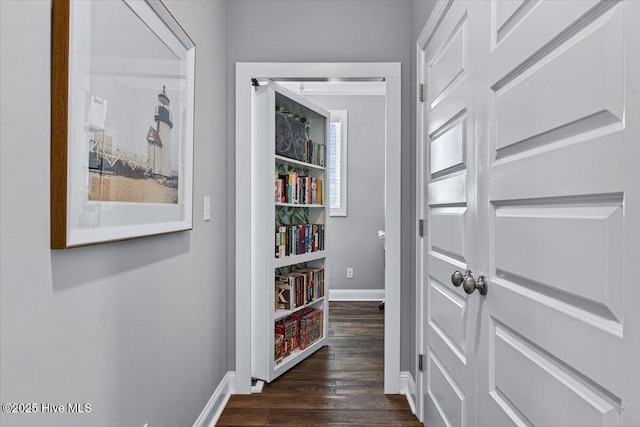 277 E Second St, Ocean Isle Beach, NC 28469 - corridor featuring baseboards and dark wood-style floors
