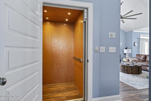 277 E Second St, Ocean Isle Beach, NC 28469 - elevator featuring wood finished floors and ceiling fan