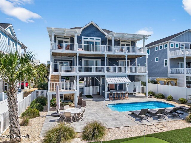 277 E Second St, Ocean Isle Beach, NC 28469 - view of pool featuring a pergola and a patio area