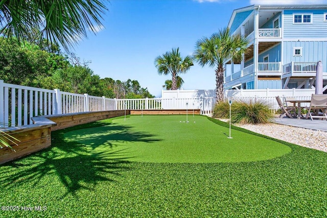277 E Second St, Ocean Isle Beach, NC 28469 - view of yard featuring a putting area and a patio