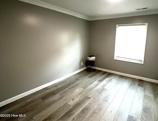 510 S Sycamore St, Fremont, NC 27830 - unfurnished room with crown molding and dark wood-type flooring