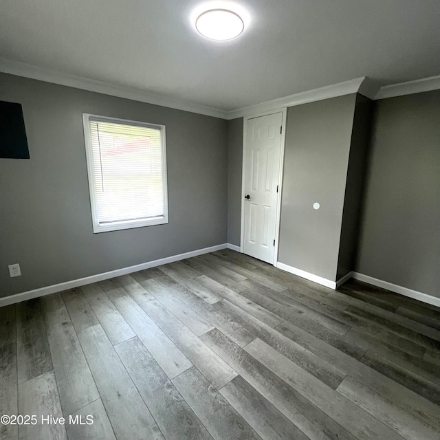 510 S Sycamore St, Fremont, NC 27830 - spare room featuring crown molding and dark wood finished floors