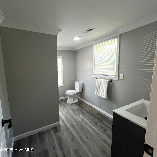 510 S Sycamore St, Fremont, NC 27830 - bathroom with vanity, ornamental molding, and wood finished floors