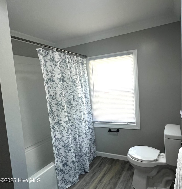 510 S Sycamore St, Fremont, NC 27830 - bathroom with wood finished floors and shower / bath combo with shower curtain