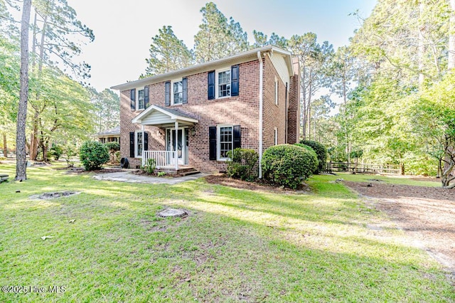 100 E Hedgelawn Way, Southern Pines, NC 28387 - colonial house featuring brick siding