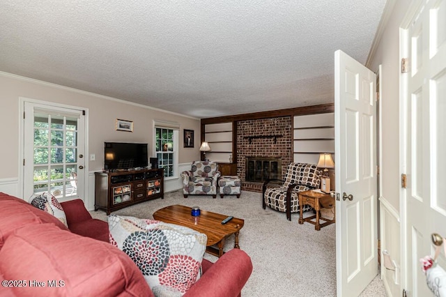 100 E Hedgelawn Way, Southern Pines, NC 28387 - carpeted living room featuring ornamental molding, a textured ceiling, and a fireplace