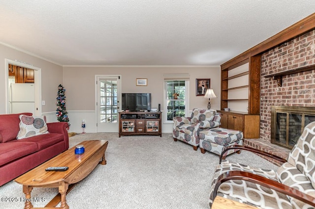 100 E Hedgelawn Way, Southern Pines, NC 28387 - carpeted living area featuring ornamental molding, healthy amount of natural light, a textured ceiling, and a fireplace