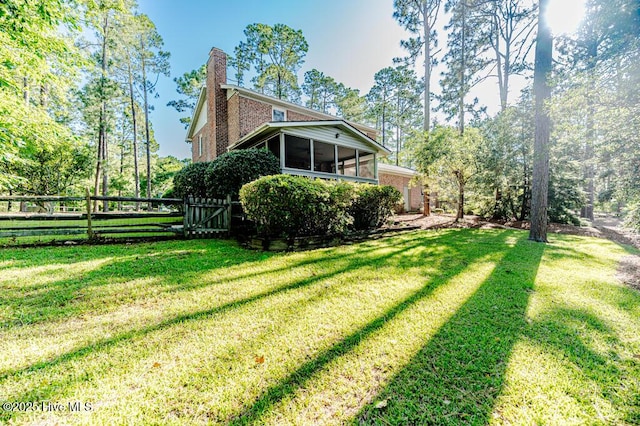 100 E Hedgelawn Way, Southern Pines, NC 28387 - view of yard with a sunroom and a gate
