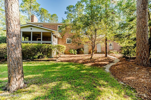 100 E Hedgelawn Way, Southern Pines, NC 28387 - view of grassy yard featuring a sunroom