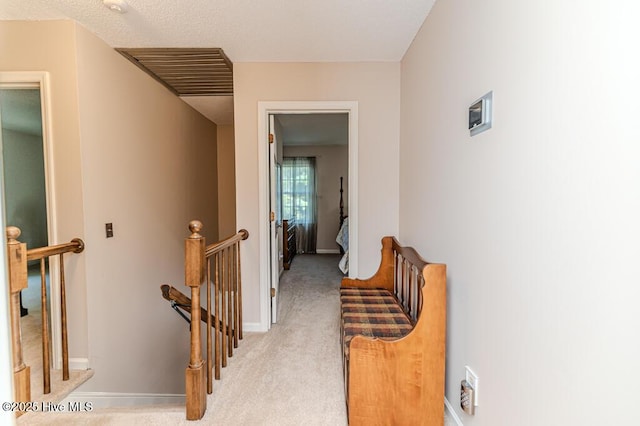 100 E Hedgelawn Way, Southern Pines, NC 28387 - corridor with an upstairs landing and light colored carpet