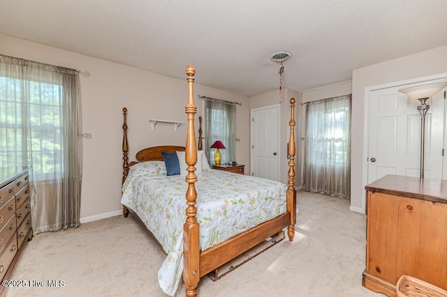 100 E Hedgelawn Way, Southern Pines, NC 28387 - bedroom with light carpet and a textured ceiling