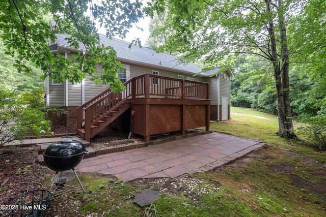 347 Stone Gate Dr, Greenville, NC 27858 - rear view of property featuring a patio, a deck, stairs, a lawn, and a shingled roof